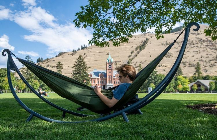 Student hanging out on a hammock