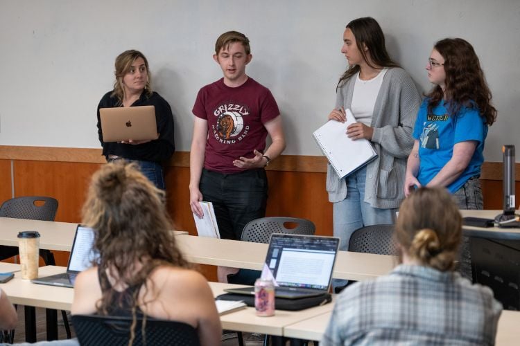 A student speaks at the front of class