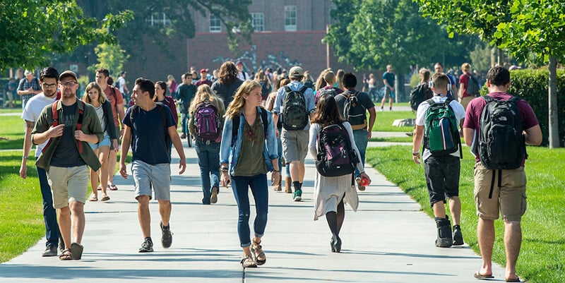 UM students walk across campus on their way to class