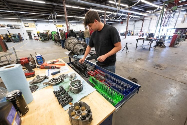 A student working with a toolbox at Missoula College