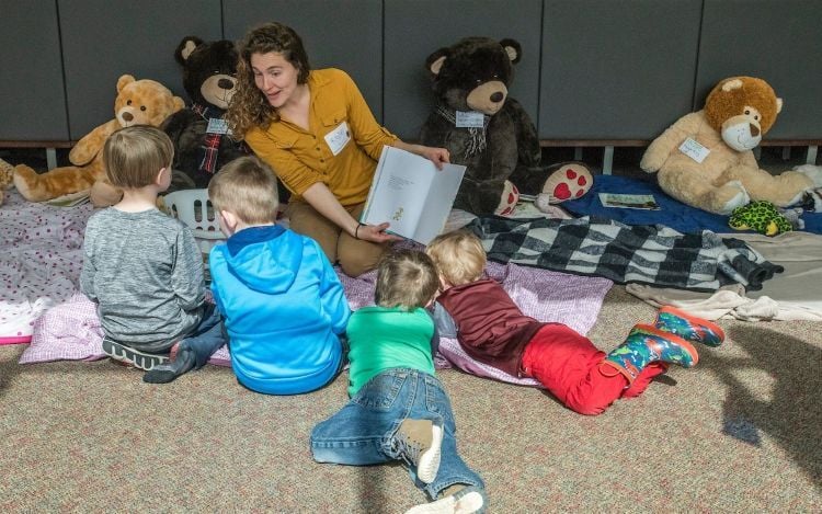Person reading to kids