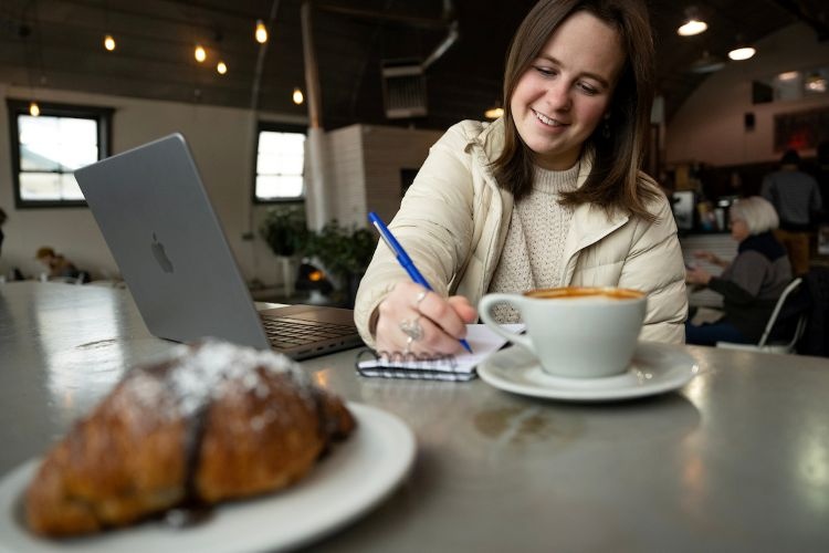A student journaling in her notebook