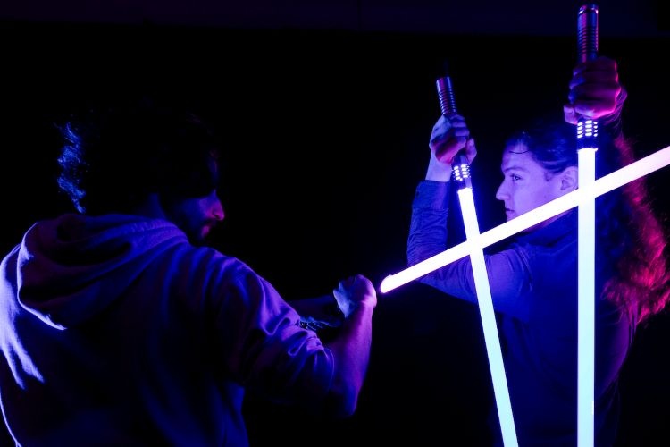 Students participating in lightsaber club
