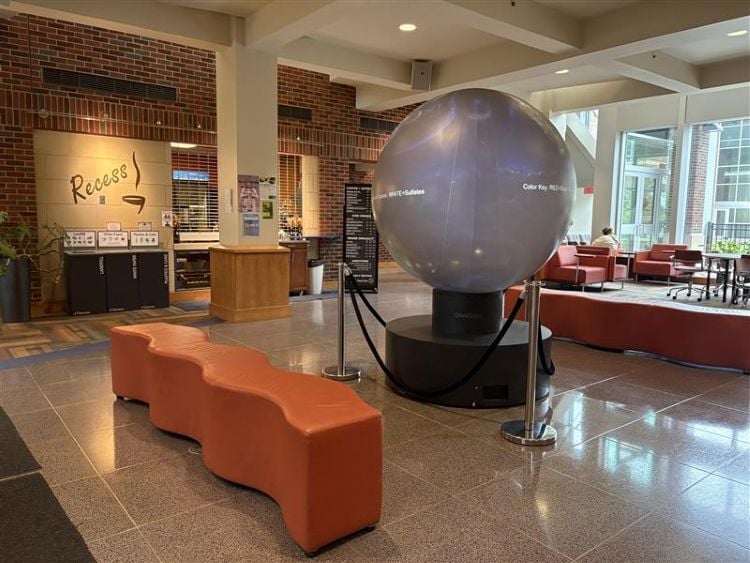 the interactive globe with the college of education building