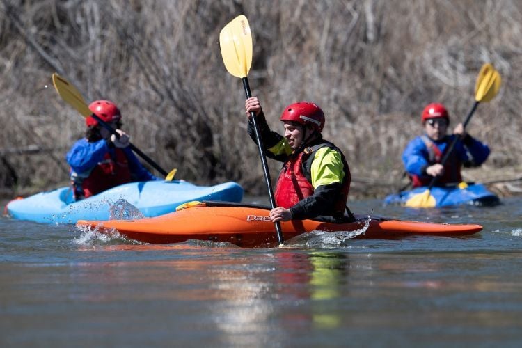 People kayaking on the river