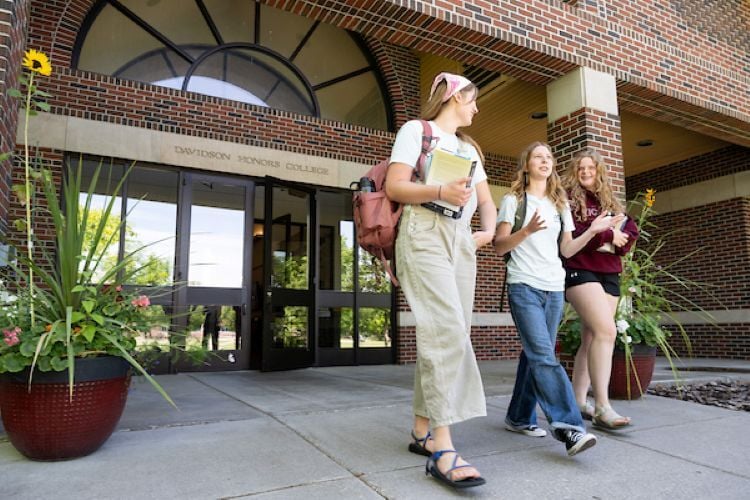 Students walking out of the DHC front door