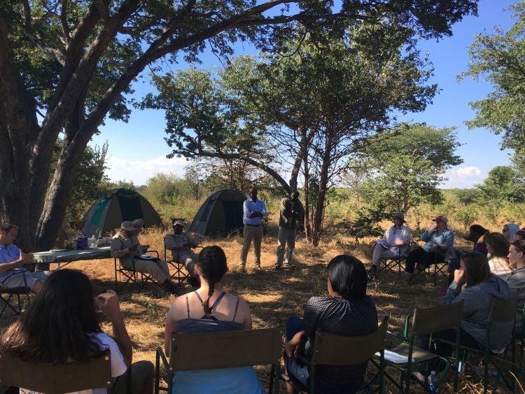 Students in the Park, Tourism and Recreation Management Program listen to an outdoor lecture at a campground