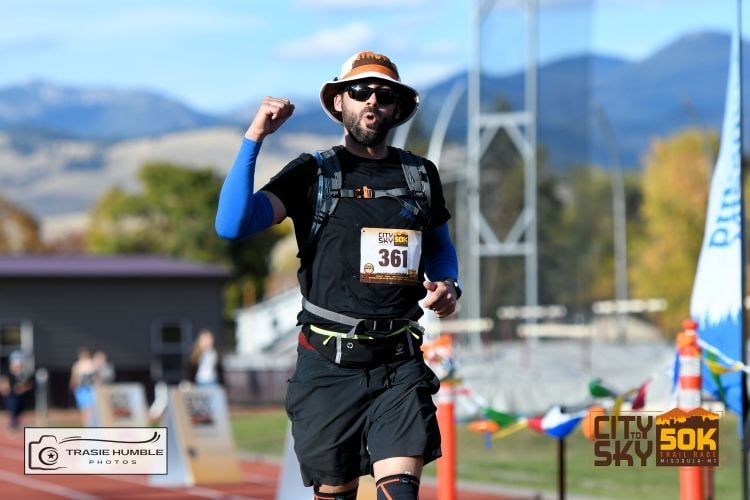 A runner about to finish the City to Sky 50K