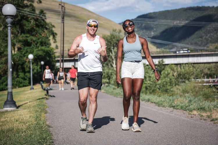 Students running and walking on the River Trail