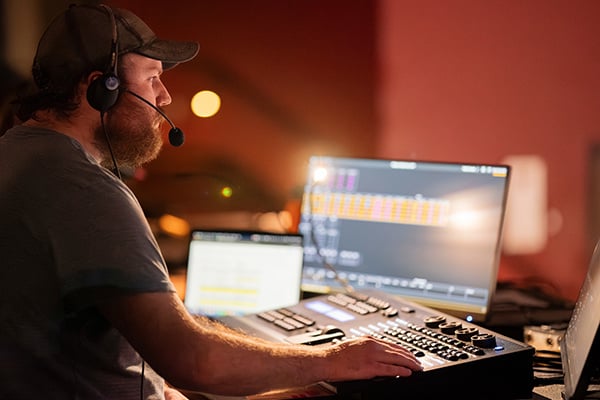 A sound technician works during a UM theatre production