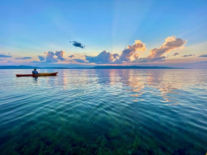 A kayaker sits atop Flathead Lake