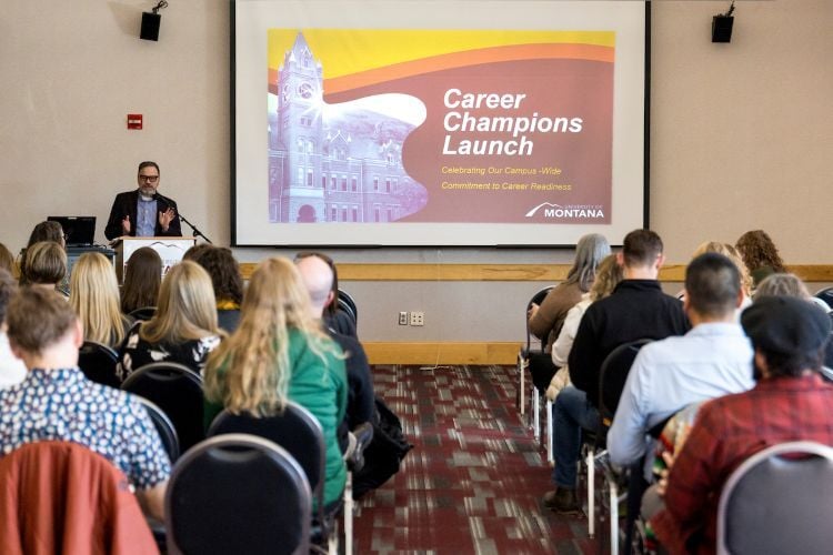 Someone giving a presentation about "UM's Career Championship Launch"
