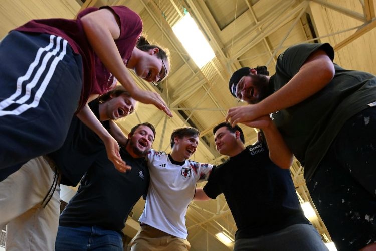 Friends huddling up during intramurals