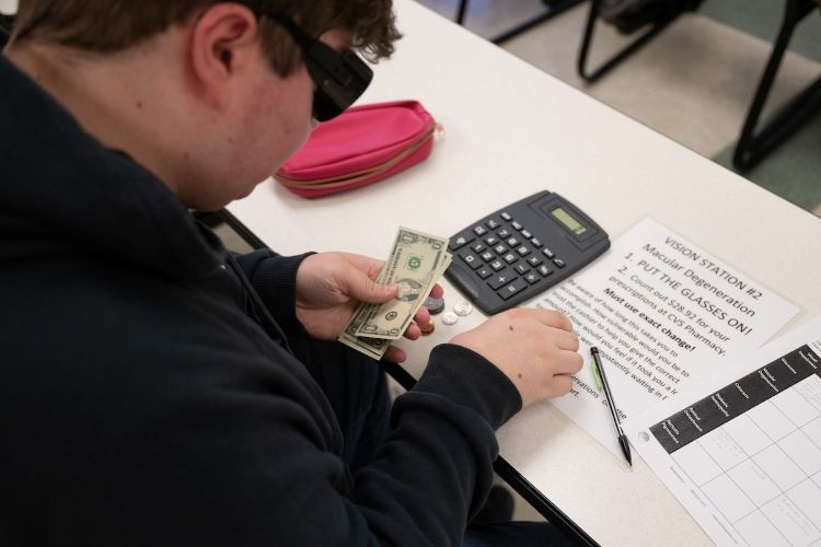 A student counting out money