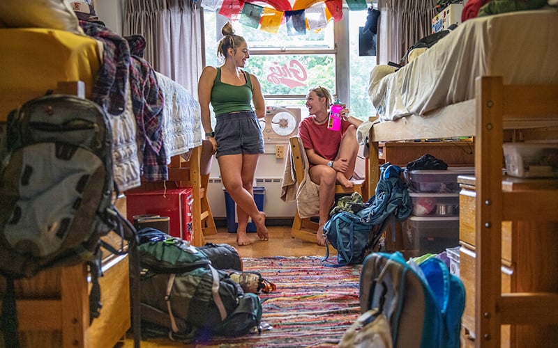 Two roommates chat in their room in Knowles Hall at UM