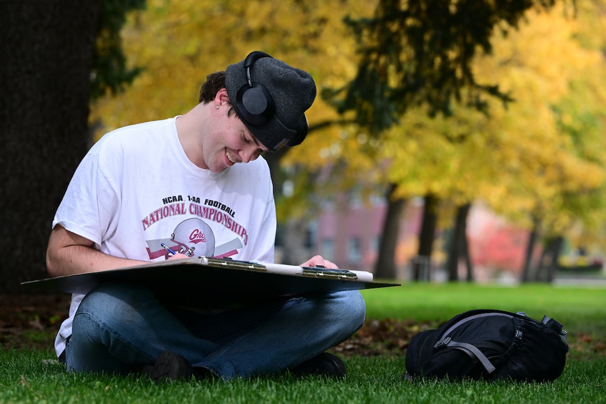 A student drawing on The Oval