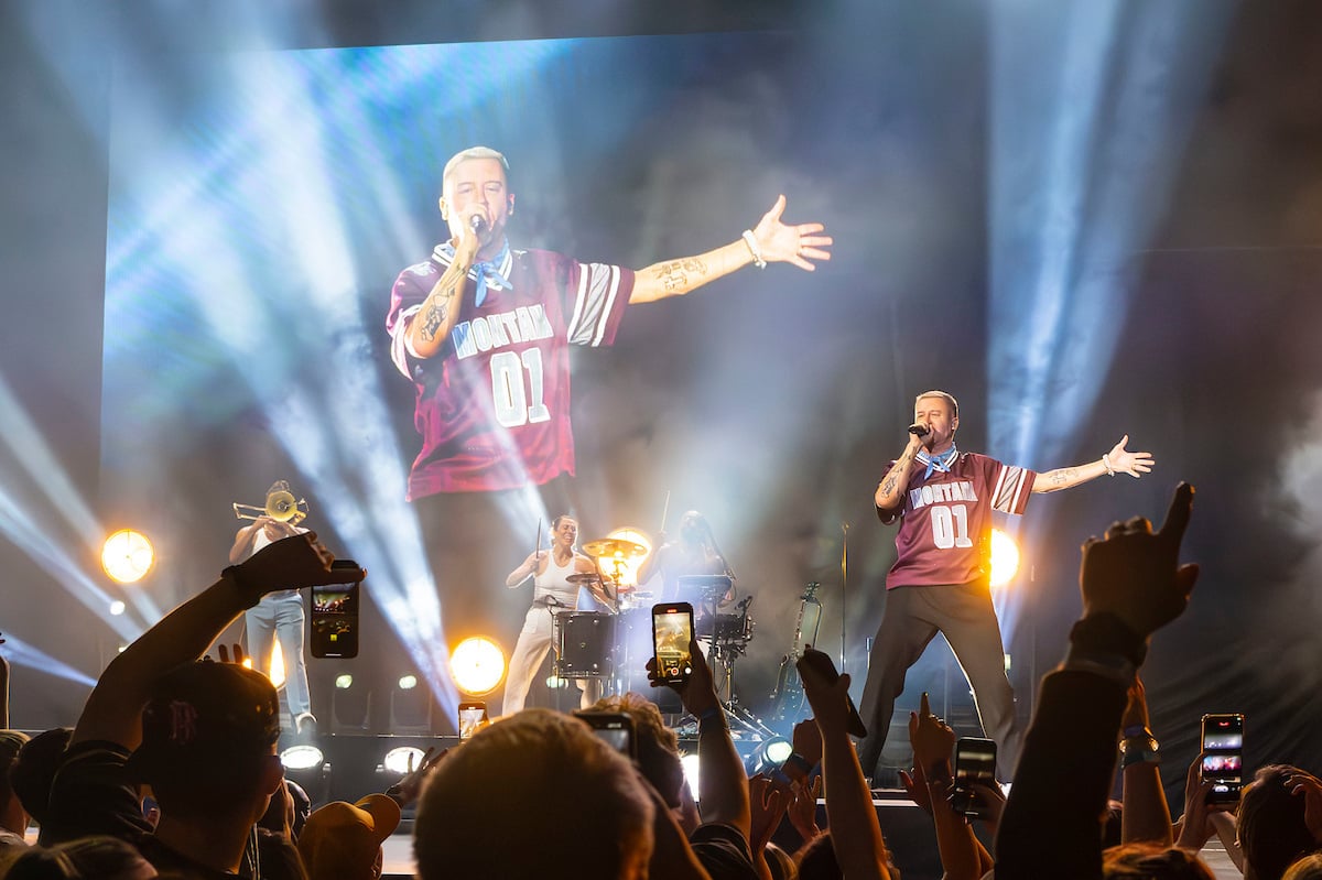 Macklemore performing at the Adams Center