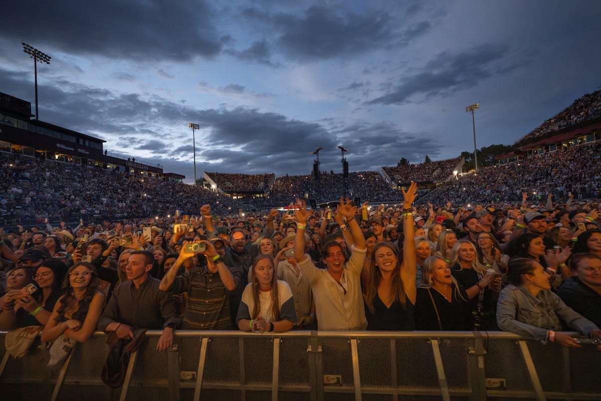 giant crowd of people attending a show at Washington-Grizzly Stadium